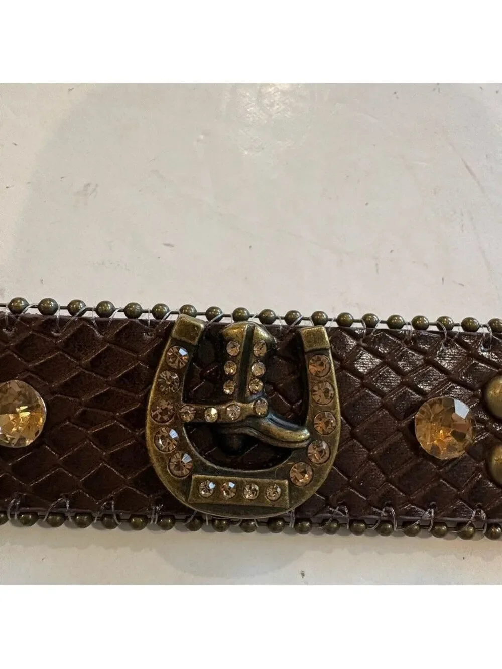 Brown leather belt adorned with amber stones and burnished gold studs. Size 24